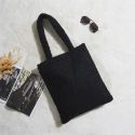 Tote bag noir en imitation fourrure 35x60cm