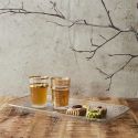 Set de 2 plateaux de service en plastique transparent motif feuilles avec contour doré (L34 cm)