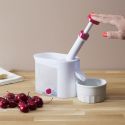 Dénoyauteur à cerises en plastique blanc et rouge