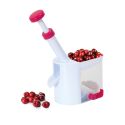 Dénoyauteur à cerises en plastique blanc et rouge